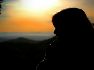 silhouette of woman during sunset